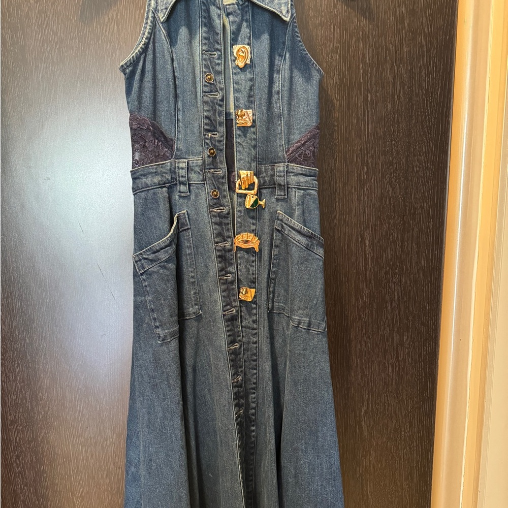 Denim maxi dress with lace detailing on the back . Never been worn.